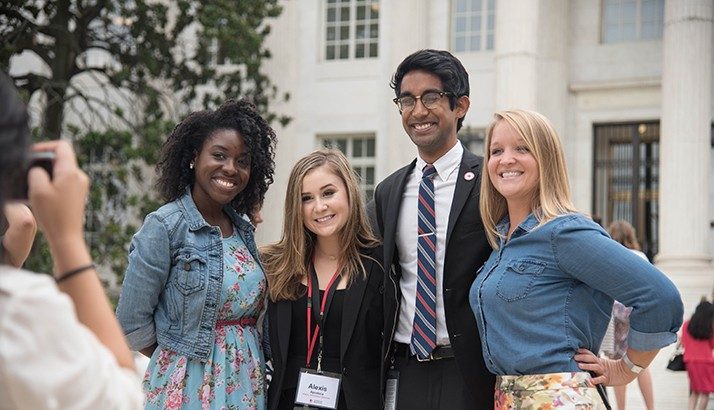 college interns in front of red cross building
